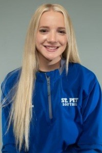 Snook, with long blond hair and a blue jacket